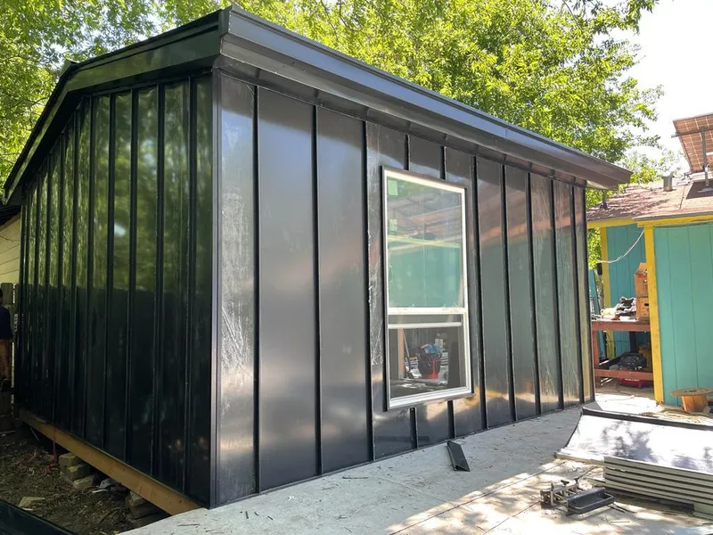 Black standing seam metal wall panels for Metal Roof Installation in Hutchison