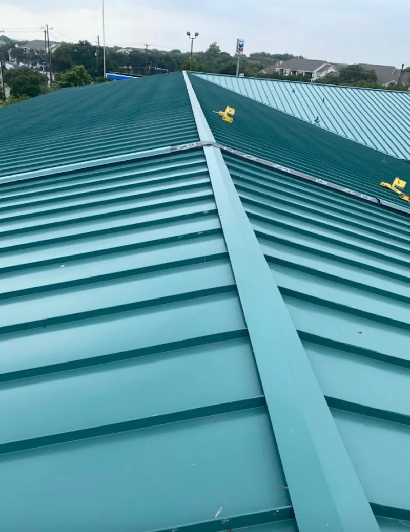 Green commercial metal roof ridge and valley for Metal Roof Repair in Hutchison